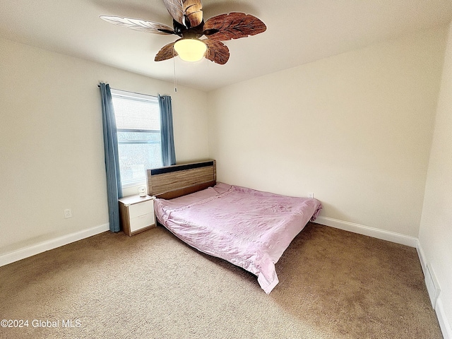 unfurnished bedroom featuring carpet flooring and ceiling fan