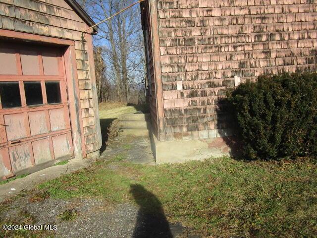 view of side of property featuring a garage