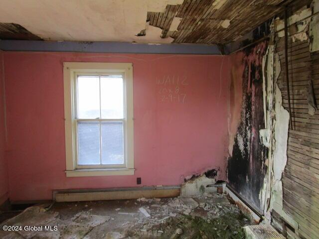 miscellaneous room with a baseboard heating unit