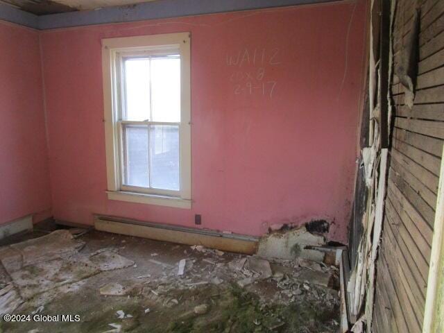 spare room with a baseboard radiator