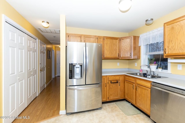 kitchen featuring light hardwood / wood-style floors, sink, and stainless steel appliances