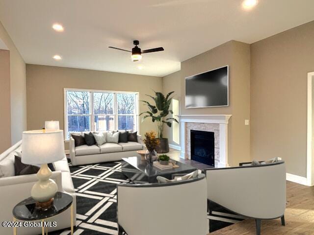 living room with ceiling fan and wood-type flooring