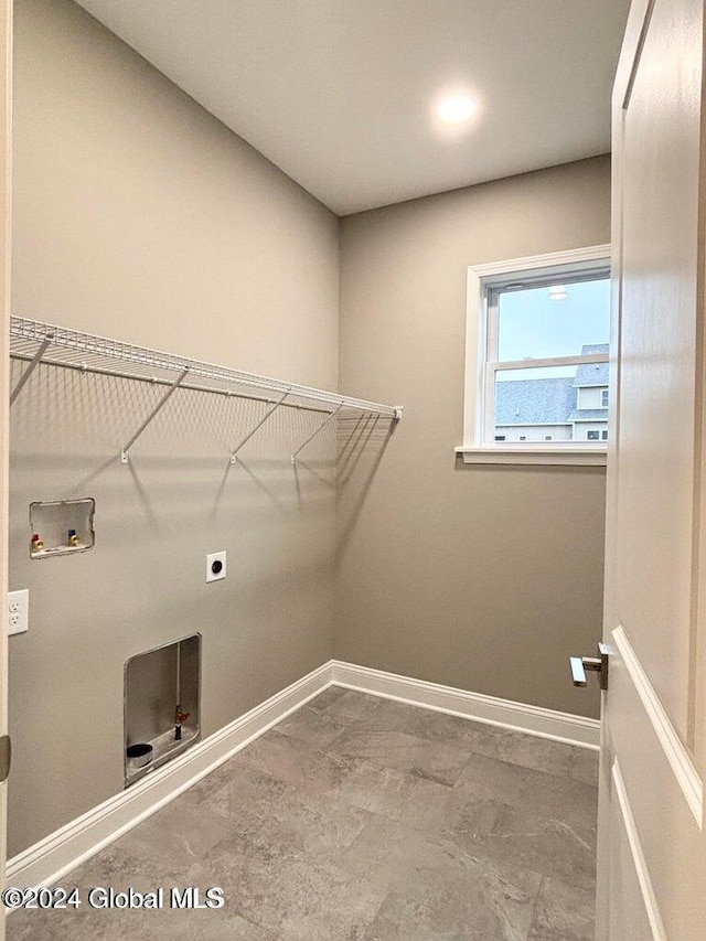 clothes washing area with hookup for an electric dryer and washer hookup