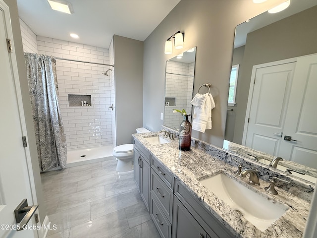 13 Bernie Loop, North Greenbush, NY 12180 - bathroom with a tile shower, toilet, and double vanity