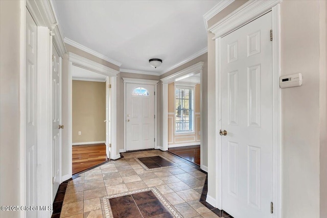 entryway featuring ornamental molding