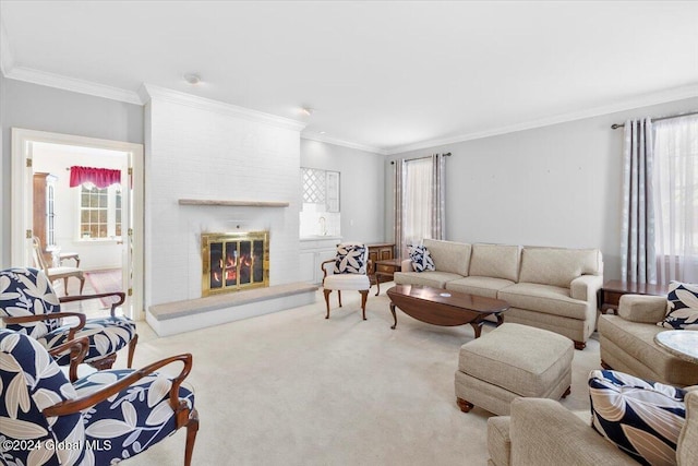 living room with plenty of natural light, a large fireplace, ornamental molding, and light carpet