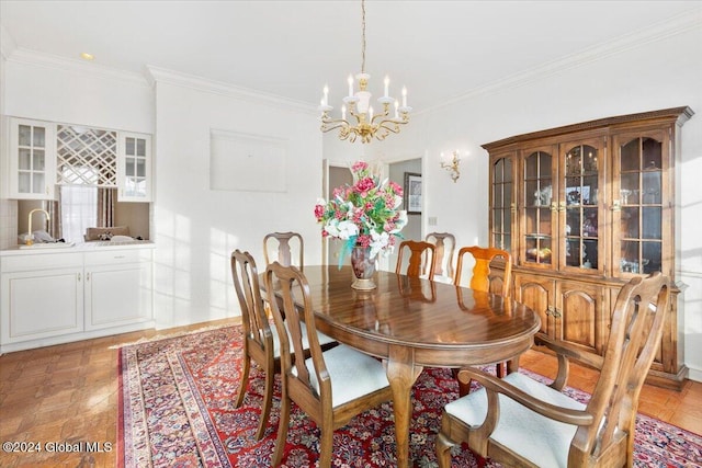 dining room with a chandelier and crown molding