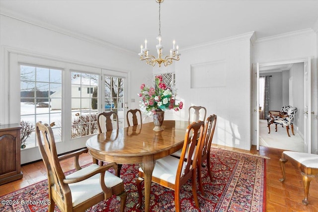 tiled dining room featuring a notable chandelier and ornamental molding