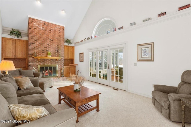 carpeted living room featuring a fireplace and high vaulted ceiling