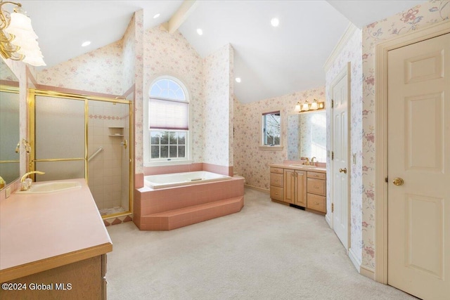 bathroom featuring shower with separate bathtub, vanity, and vaulted ceiling with beams