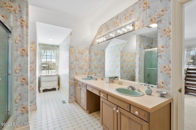 bathroom with vanity and walk in shower