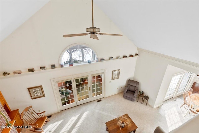 living room featuring french doors, light colored carpet, high vaulted ceiling, and ceiling fan