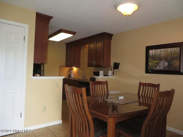 tiled dining room with sink