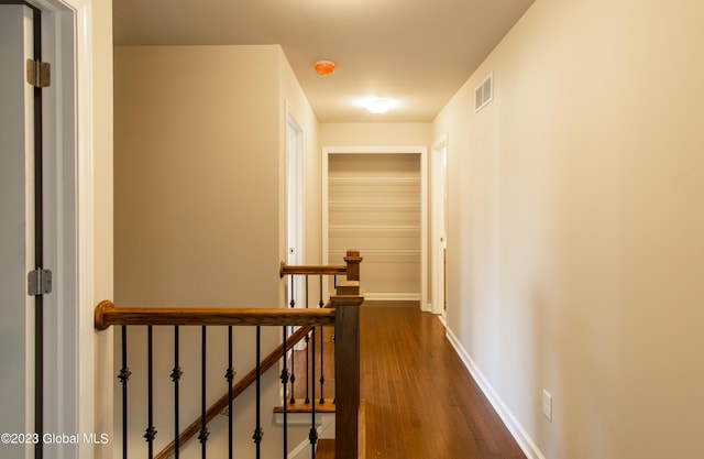 hall with dark hardwood / wood-style flooring