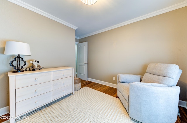 sitting room featuring ornamental molding and hardwood / wood-style floors