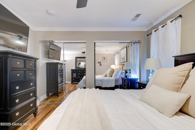 bedroom featuring ornamental molding, ceiling fan, and hardwood / wood-style floors