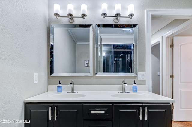 bathroom with crown molding and vanity