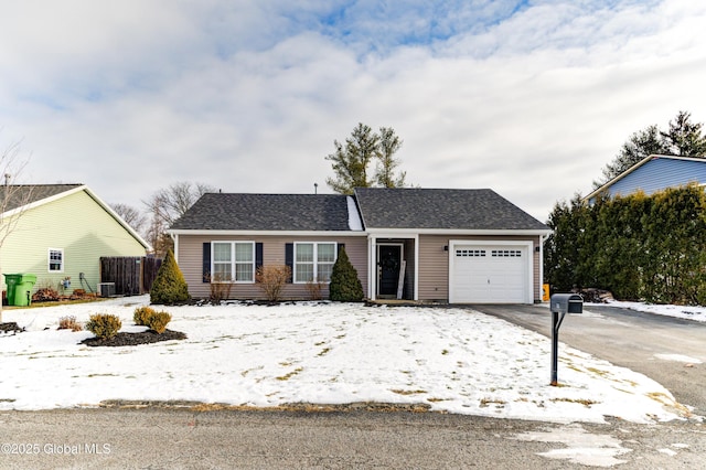 view of front of house featuring central AC and a garage