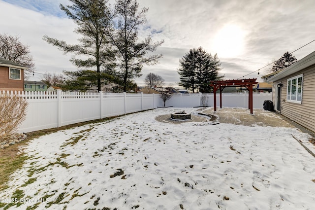 view of yard with a pergola and an outdoor fire pit