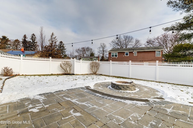 view of patio / terrace with an outdoor fire pit