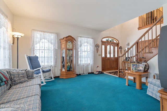 sitting room featuring carpet flooring and a healthy amount of sunlight