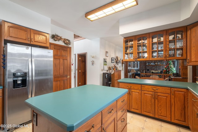 kitchen with stainless steel fridge and a center island