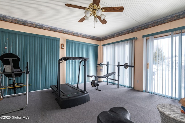 exercise area with carpet flooring and ceiling fan