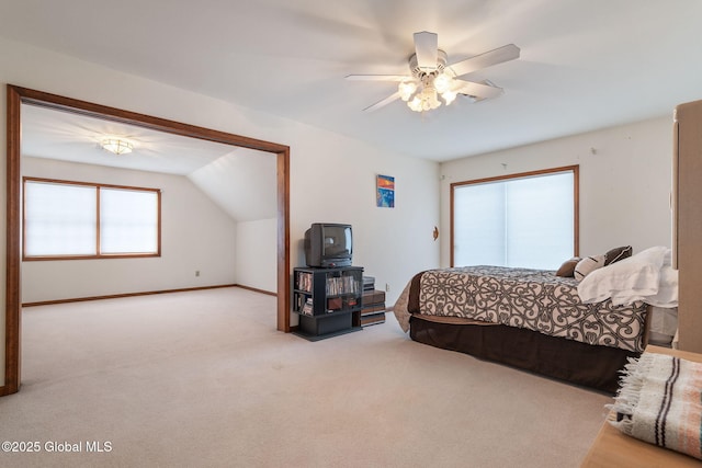 carpeted bedroom featuring ceiling fan and lofted ceiling