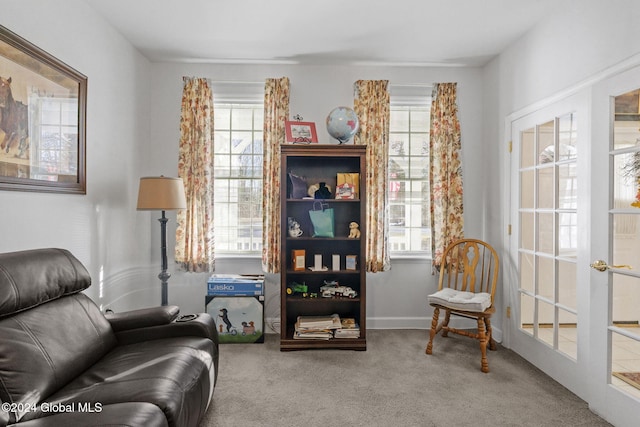 sitting room with french doors, carpet flooring, and a wealth of natural light