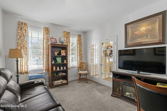 carpeted living room with french doors