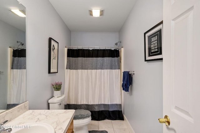 bathroom featuring curtained shower, tile patterned floors, vanity, and toilet