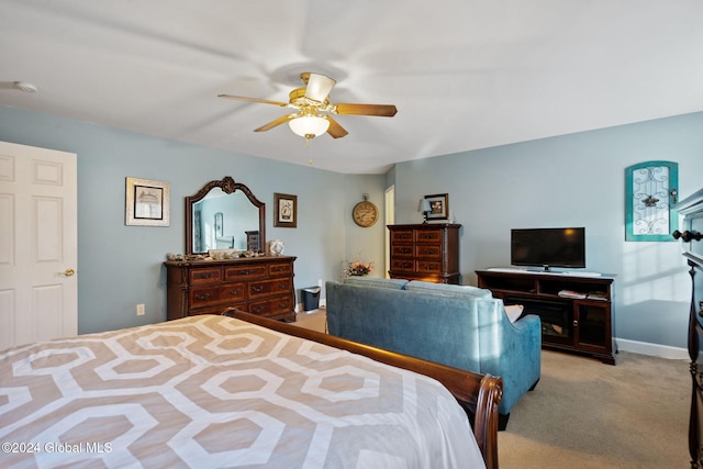 bedroom with ceiling fan and light colored carpet