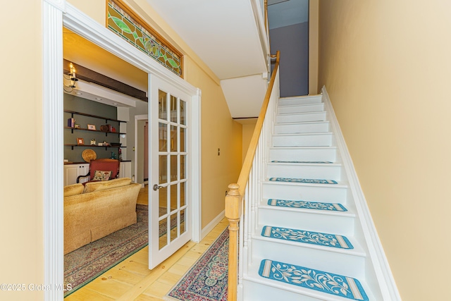 staircase with french doors