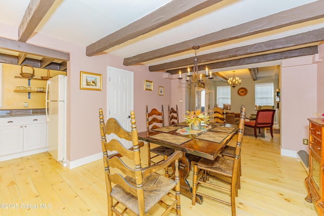 dining area with beamed ceiling, light hardwood / wood-style floors, and a notable chandelier