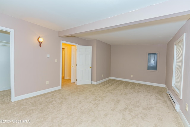 interior space with electric panel, baseboard heating, and light carpet