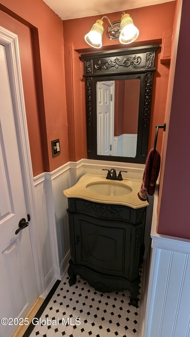 bathroom with tile patterned floors and vanity