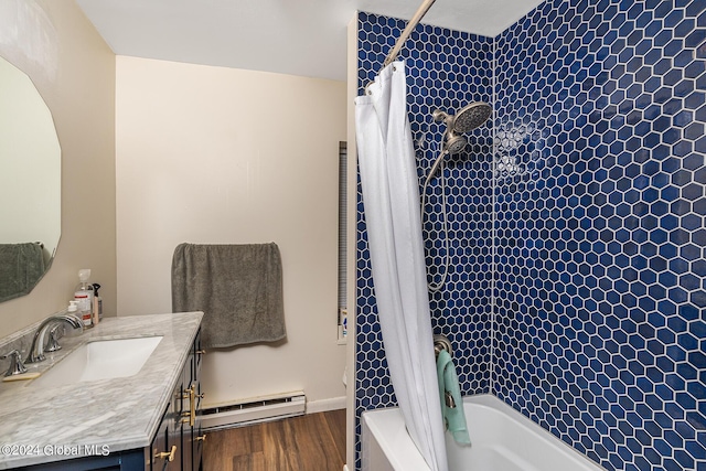 bathroom featuring hardwood / wood-style floors, vanity, shower / tub combo with curtain, and a baseboard heating unit