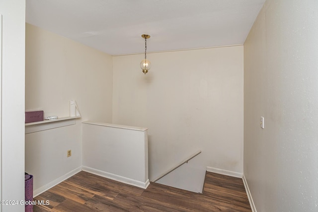 corridor featuring dark hardwood / wood-style floors