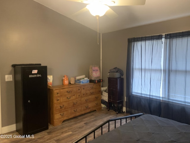 bedroom featuring hardwood / wood-style floors and ceiling fan