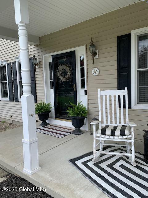 property entrance with covered porch