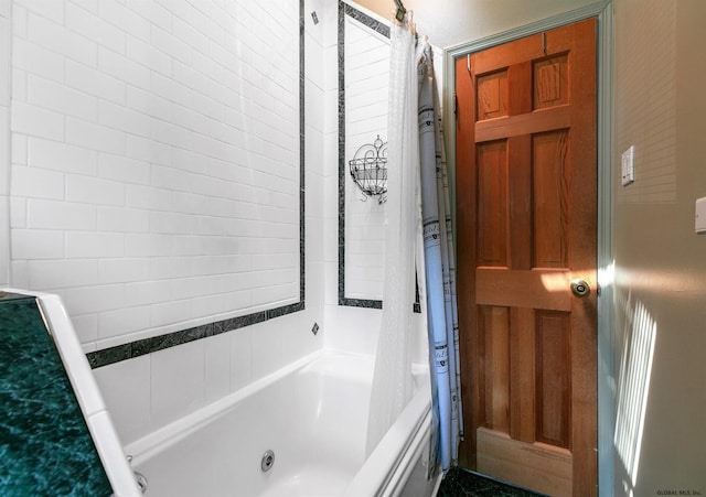 bathroom with shower / bath combo with shower curtain