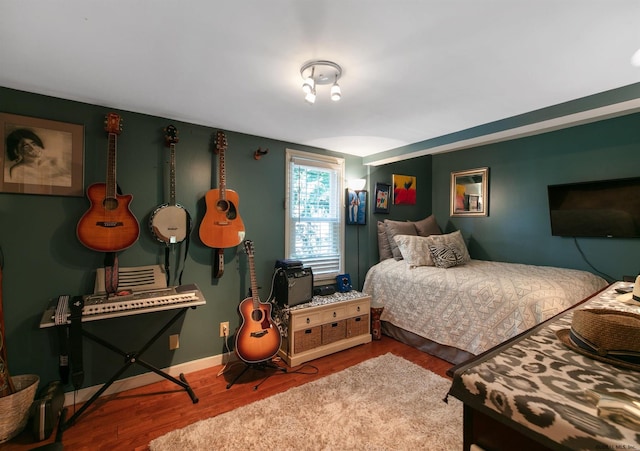 bedroom with hardwood / wood-style floors