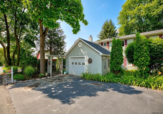 view of front of home featuring an outbuilding and a garage