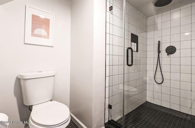 bathroom featuring an enclosed shower, toilet, and tile patterned floors