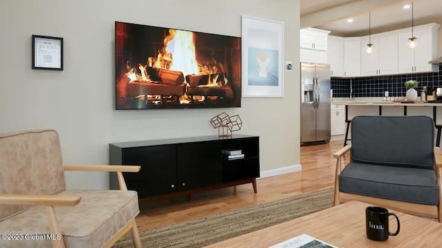 living area with light hardwood / wood-style floors