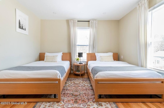 bedroom with light hardwood / wood-style floors