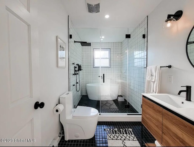 full bathroom featuring plus walk in shower, tile patterned flooring, vanity, and toilet