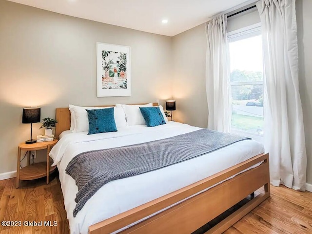 bedroom featuring light wood-type flooring