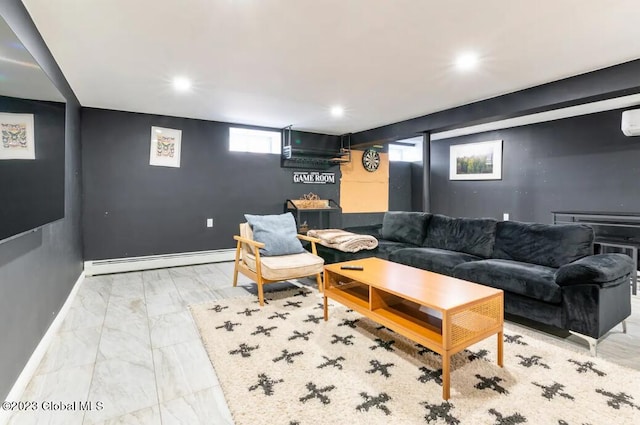 living room with baseboard heating and a wall unit AC