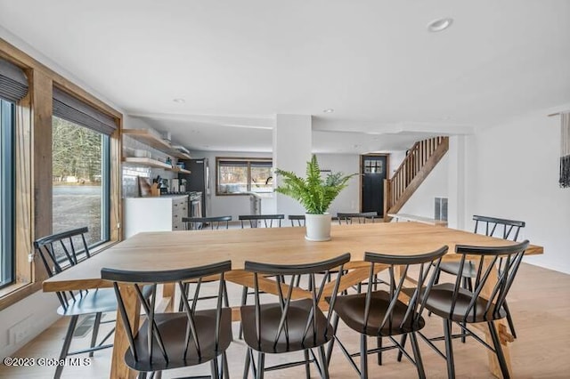 dining area with light hardwood / wood-style flooring